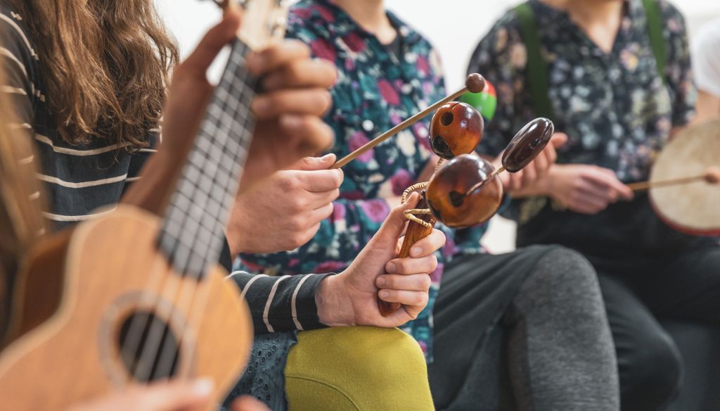 Music therapy concept, a group of people playing different types of musical instruments, music healing.